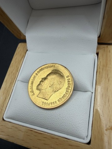 Złota moneta  W komplecie dokument z przeprowadzonego badani