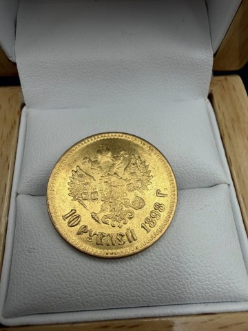 Złota moneta W komplecie dokument z przeprowadzonego badani